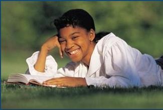 Student reading outdoors