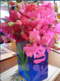 Pink flowers in a decorative blue pot